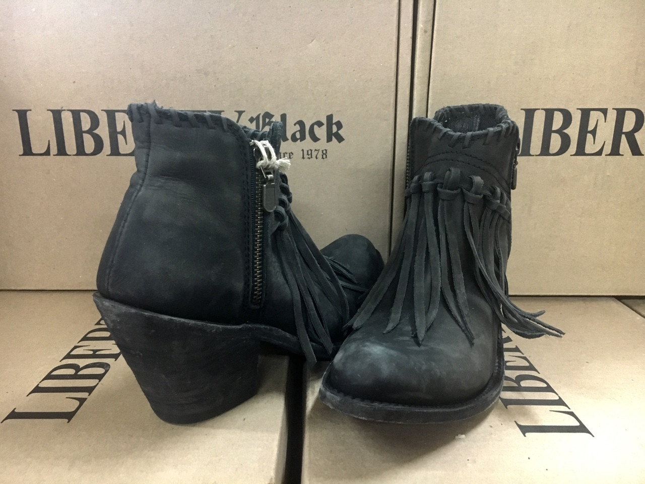 black booties with fringe