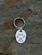 Sterling silver oval paw print keyring and sterling silver split ring. Our popular oval shape keyring