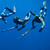 Four free-divers in wetsuits swimming underwater in clear blue ocean, demonstrating Ocean Guardian Shark Shield protection