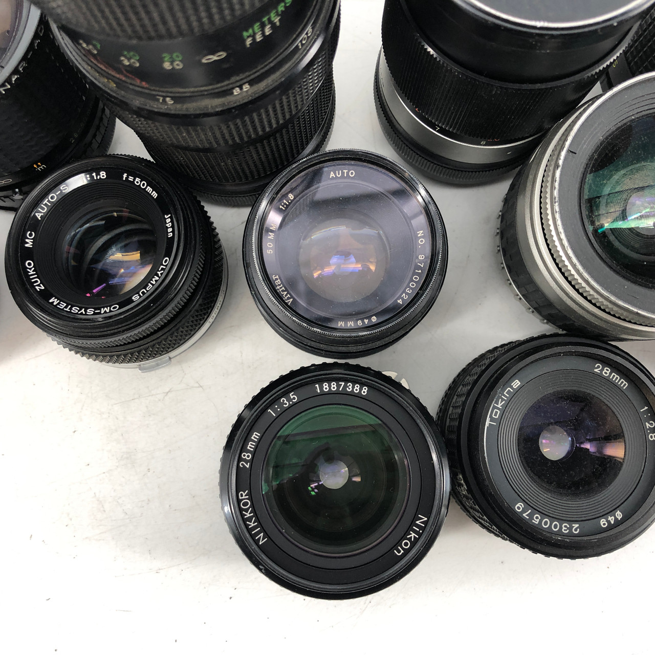 ASSORTED MF 11 LENSES FROM VIVATAR, MINOLTA, PENTAX AND MORE