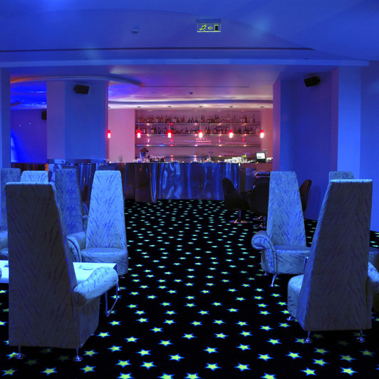 Joy Carpets Neon Lights Seeing Stars Fluorescent 929 Commercial Carpet Tile Room Scene