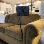 Flexible iPad stand shown attached to couch Flexible iPad stand shown attached to couch