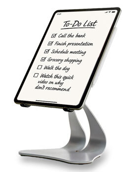 Silver Stabile PRO iPad stand holding an iPad with an Apple Pencil and a handwritten to-do list, shown as a stable desktop tablet setup.