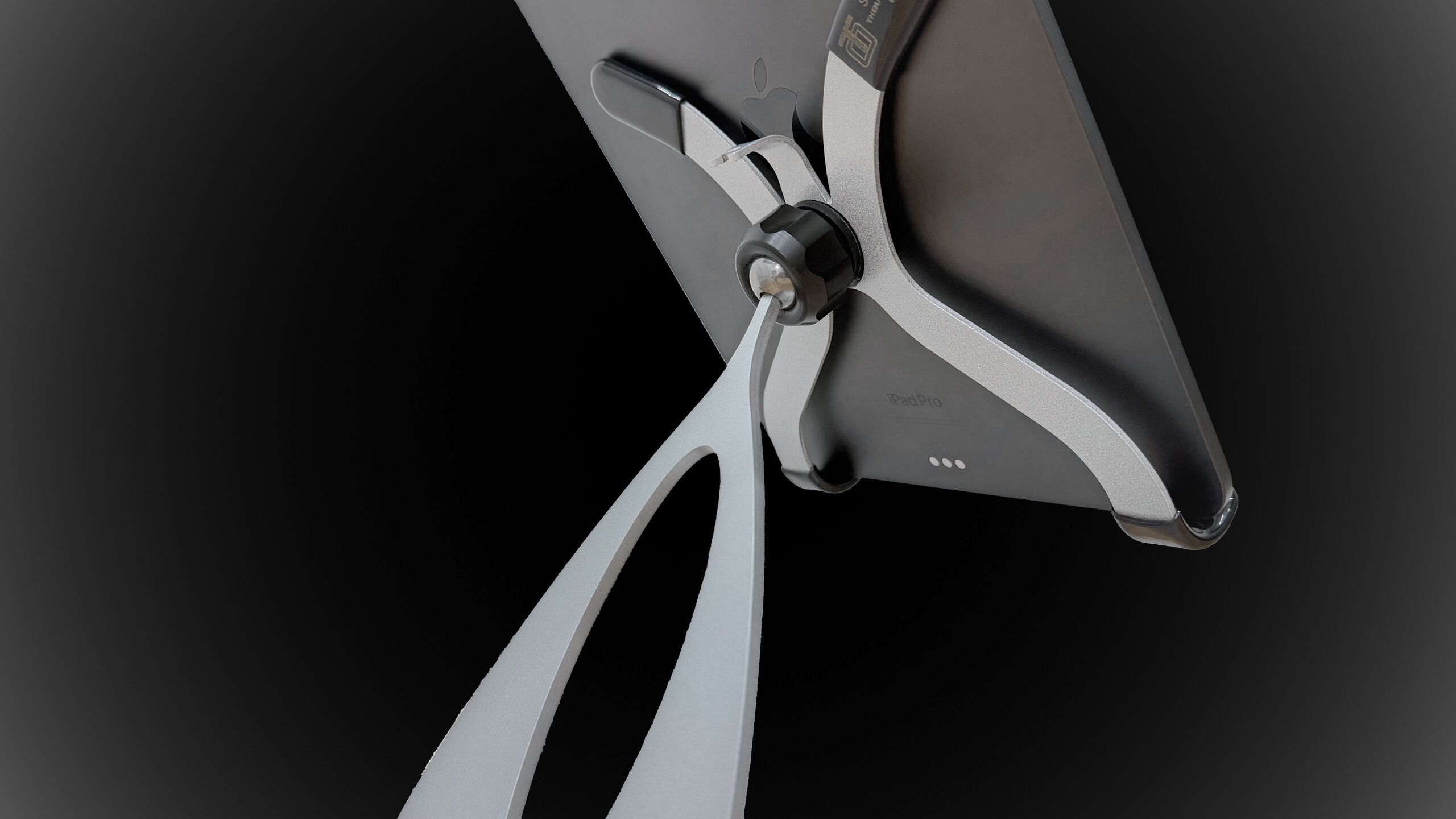 Heavy duty iPad and iPhone stands on countertop in commercial check-in setting, USA-made by Thought Out