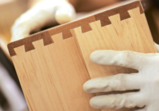 Cabinetmaker assembling a dovetail drawer