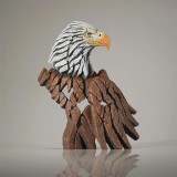 Enesco Mini Eagle Bust Edge Sculpture 5.5-Inch Hand Crafted, a detailed wooden eagle sculpture with a white and gray head and a brown feathered body.