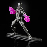 Marvel Silver Surfer with Mjolnir 6-inch Action Figure, Avengers Marvel Legends Series, metallic silver figure with glowing pink weaponry, standing on a surfboard base.