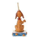 Enesco Max with Bell on Tail Jim Shore 5 Inch Figurine Grinch Collection, front view of a sitting dog figurine with a red collar and decorative design on its back, standing on a colorful base with oranges and blue scrollwork.