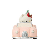 Disney Hello Kitty Christmas Car 4.5 Figurine by Jim Shore 6018640, pink Christmas car with Hello Kitty character on top, decorated with a red bow, holly, and a small Christmas tree.