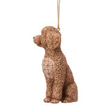 Enesco Goldendoodle Jim Shore Heartwood Creek 4.5-Inch Ornament, a detailed brown Goldendoodle dog figurine with textured fur and a decorative geometric design on its side, hanging by a ribbon.