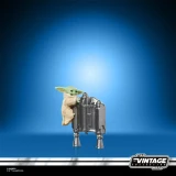 Star Wars The Mandalorian & Grogu Deluxe Star Wars Vintage Collection 3.75-Inch Action Figure VC395, featuring a detailed Grogu figurine with large ears, sitting on a metallic silver speeder or droid accessory against a blue background.
