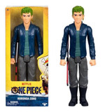 One Piece Roronoa Zoro One Piece Moose Toys 12-Inch Large Action Figure, a detailed collectible toy of Roronoa Zoro from One Piece, featuring green hair, a navy jacket, gray pants, and a sword accessory.