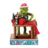 Enesco Grinch Sewing Santa Suit Jim Shore 6.5 Inch Figurine, Grinch character sewing a Santa suit on a vintage sewing machine with a small dog, Christmas decorations, and colorful base.