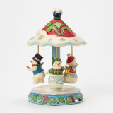 Enesco Rotating Snowman Carousel Jim Shore 12 Inch Figurine Heartwood Creek, colorful snowman carousel with three snowmen, one holding a lantern, decorated with holly and snowflakes.