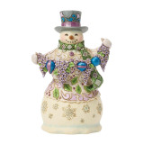 Disney Purple Snowman Jim Shore 7 Inch Figurine Heartwood Creek 6019283, a detailed decorative snowman figurine wearing a purple top hat, a green scarf, and holding a bouquet of purple flowers and colorful ornaments.
