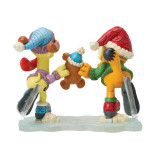 Enesco Garfield, Odie & Pooky Skating Jim Shore 6 Inch Figurine from the Garfield Collection, featuring Garfield and Odie wearing festive Christmas hats while skating and sharing a gingerbread cookie.