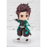 Dragon Ball Z Tanjiro Kamado Demon Slayer Figuarts Statue, chibi-style figurine with detailed features, wielding a sword and wearing a checkered haori, standing on a clear round base against a white brick background.