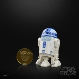 Star Wars R2-D2 Artoo-Detoo Star Wars The Black Series Droids 6-Inch Cardback Action Figure, white and blue droid toy with detailed design and small size, displayed next to a gold coin for scale.