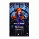 Monster High Agnes DeMille Monster High Wednesday Series 10 Inch Doll, doll with red hair and purple outfit in packaging with clock-themed background.