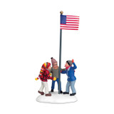 Department 56 Triple Dog Dare Department 56 A Christmas Story Village 4.375-Inch Figurine 805032, depicting three children hoisting an American flag on a snow-covered base.