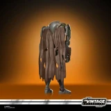 Star Wars Mercenary Droid Star Wars Vintage Collection 3.75-Inch Action Figure VC407, detailed figure with torn brown cape and robotic limbs, standing on a surface with an orange gradient background.