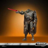 Star Wars Mercenary Droid Star Wars Vintage Collection 3.75-Inch Action Figure VC407, detailed action figure standing with a red lightsaber and black cape, against a warm brown background.