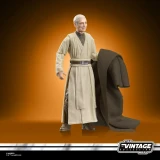 Star Wars Anakin Skywalker Star Wars ROTJ Vintage Collection 3.75-Inch Action Figure, detailed figurine of Anakin Skywalker in Jedi robes, holding a coat, with a smiling face and pose, on an orange background.