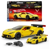 Hot Wheels '20 Corvette C8.R Hot Wheels Brick Shop Speed Series 261-Piece 1:32 Building Set, yellow brick-built Corvette race car with black wheels and rear spoiler displayed alongside a matching die-cast car, spare wheels, and retail packaging.