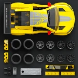 Hot Wheels ’20 Corvette C8.R Hot Wheels Brick Shop Speed Series 261-Piece 1:32 Building Set, top-down view of the assembled yellow Corvette race car with its brick components and alternate wheels arranged below