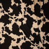 Black and Ivory Cow Print Double Brushed Poly/Spandex Fabric By The Yard - Wide shot