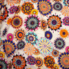 Bright Bursts on Ivory Poly Peachskin Fabric By The Yard - Wide shot