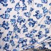 Blue, Black, and Turquoise Hibiscus Floral on White Crepe Textured Liverpool Knit Fabric By The Yard - Wide shot