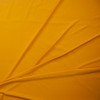 Goldenrod Solid Bullet Liverpool Knit Fabric By The Yard - Wide shot