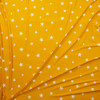 White on Mustard Stars Double Brushed Poly Spandex Knit Fabric By The Yard - Wide shot