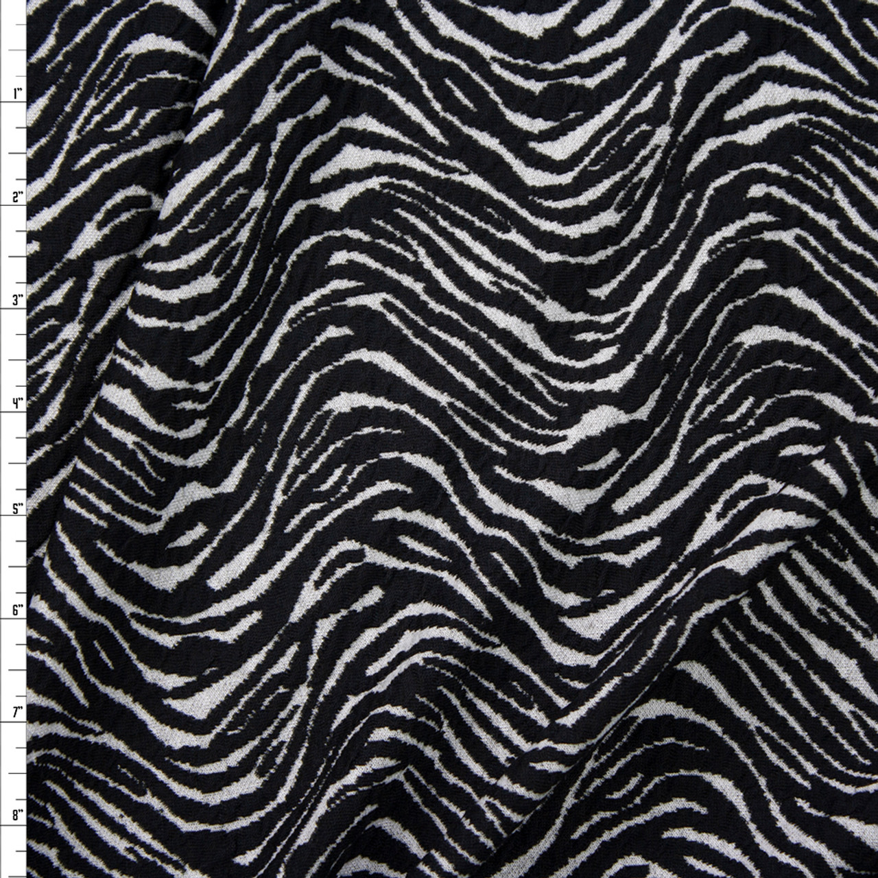 Short, dark grey zebra pattern, sports binder, flattening the