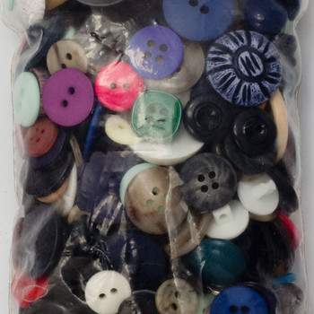 Miscellaneous colored buttons by the bag