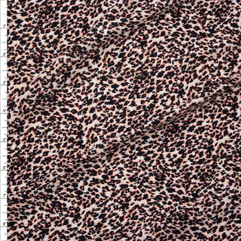 Black, Pink, and Ivory Cheetah on White Stretch Polyester Fashion Knit Fabric By The Yard