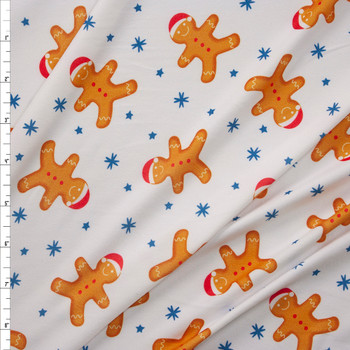 Tossed Gingerbread Men on White Stretch Double Brushed Poly/Spandex Knit Fabric By The Yard