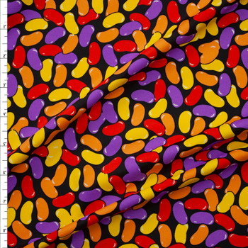 Yellow, Orange, Red, and Purple Jelly Beans on Black Nylon/Spandex Swim Knit Fabric By The Yard