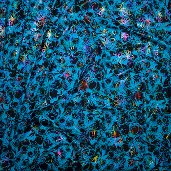 Turquoise and black spiral flowers with rainbow metallic spiral flower overlay Fabric By The Yard - Wide shot