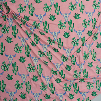 Cactus and Bull Skulls on Pink Lightweight Stretch Poly/Spandex Knit Fabric By The Yard - Wide shot Cactus and Bull Skulls on Pink Lightweight Stretch Poly/Spandex Knit Fabric By The Yard - Wide shot