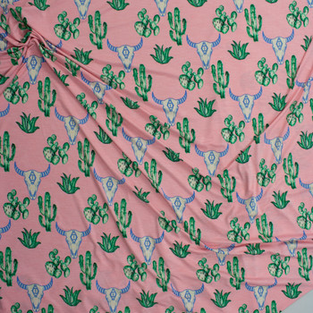 Cactus and Bull Skulls on Pink Lightweight Stretch Poly/Spandex Knit Fabric By The Yard - Wide shot