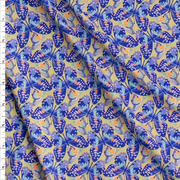 Blue Butterflies on Yellow Nylon/Spandex Fabric By The Yard