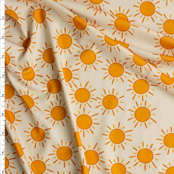 Suns on Ivory Double Brushed Poly/Spandex Fabric By The Yard