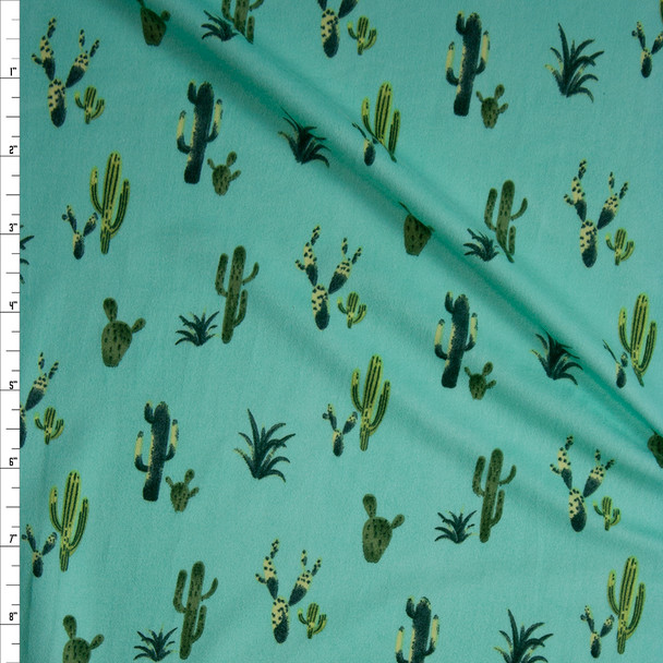 Green Cactus on Mint Double Brushed Poly/Spandex Knit Fabric By The Yard