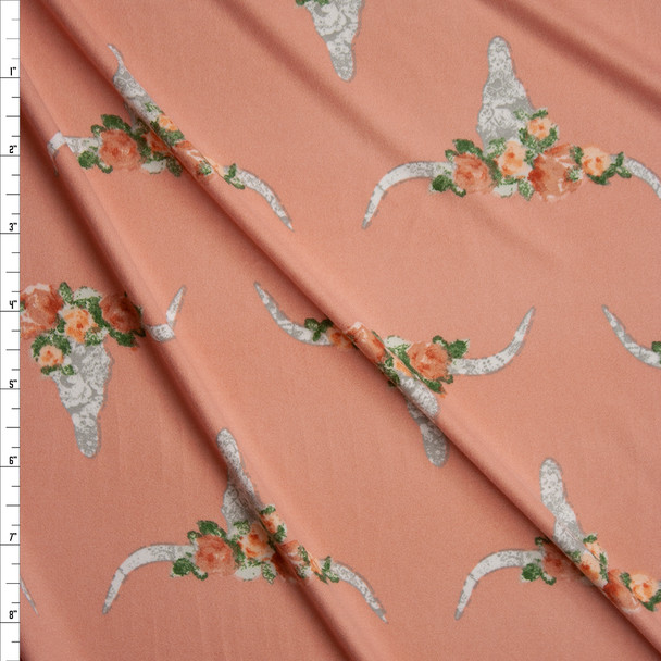 White and Grey Flowered Cow Skulls on Peach Double Brushed Poly Spandex Knit Fabric By The Yard