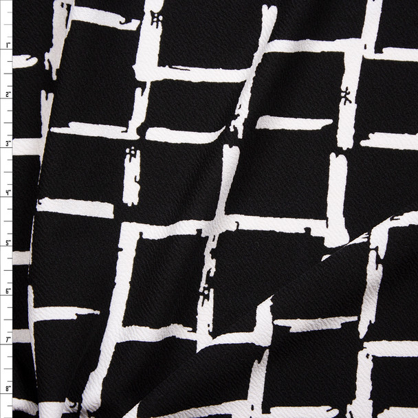 White Grunge Grid on Black Crepe Liverpool Knit Fabric By The Yard