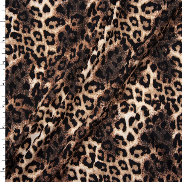 Black, Tan, and Brown Cheetah Print Double Brushed Poly Spandex Knit Fabric By The Yard
