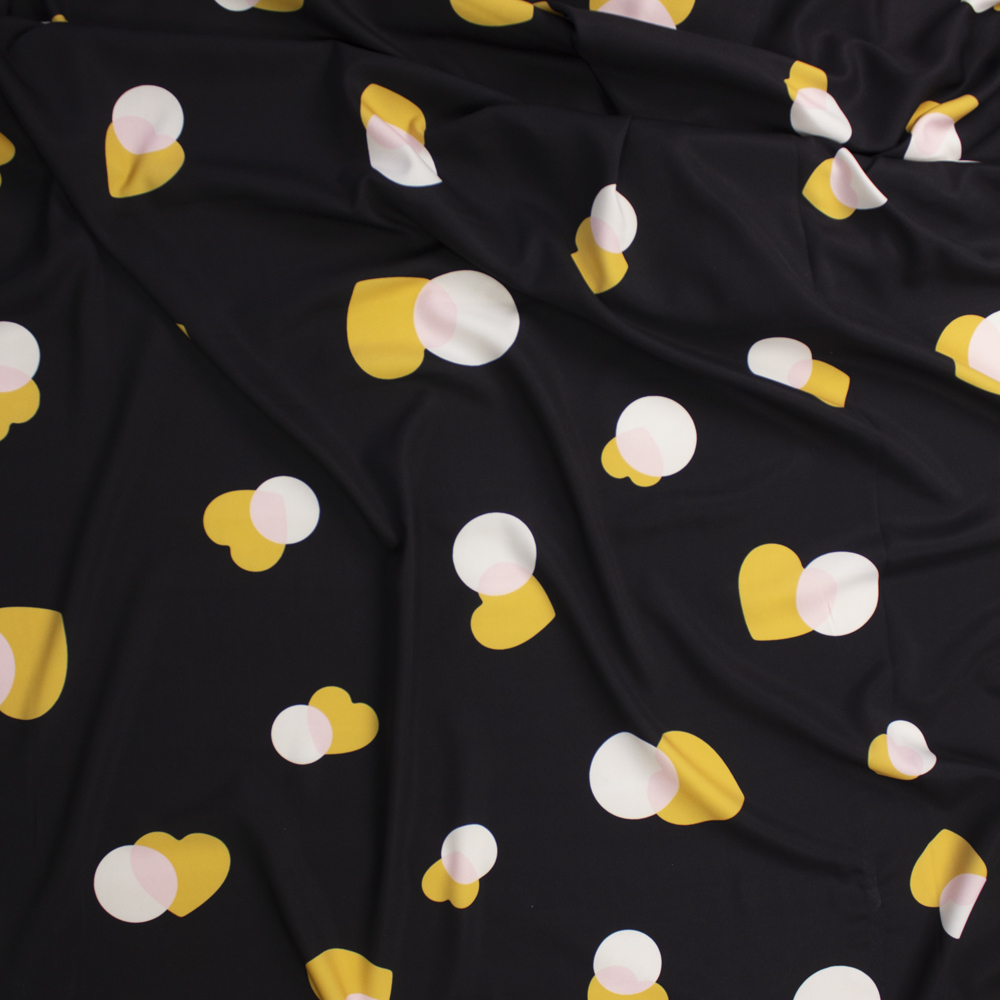 Yellow, Pink, and Offwhite Hearts and Circles on Black Peachskin Fabric By The Yard - Wide shot
