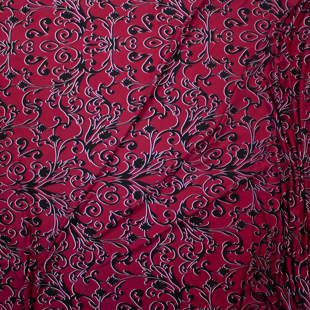 Black Scrollwork on Wine Lightweight Poly/Spandex Knit Fabric By The Yard - Wide shot